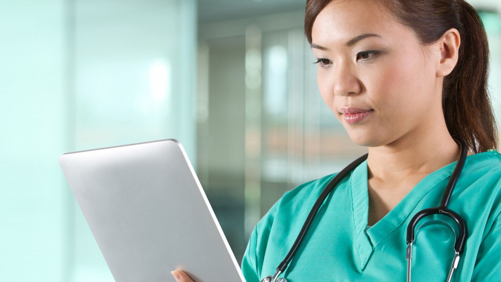 Portrait of a Female doctor holding a digital tablet.