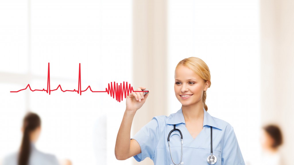 smiling doctor or nurse drawing electrocardiogram